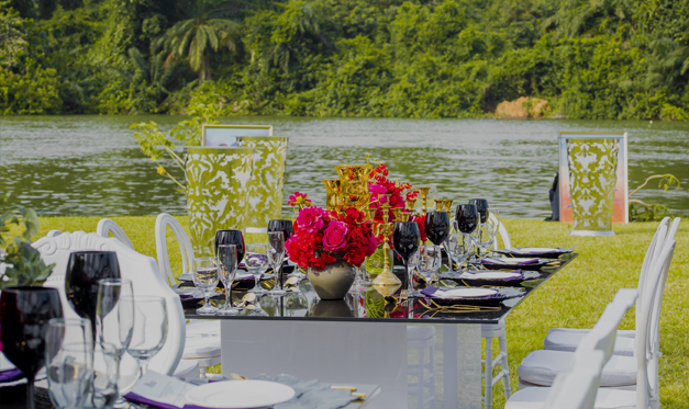 An image of a beautiful banquet dining set-up held outdoors near the Volta River at The Royal Senchi Hotel and Resort in Ghana