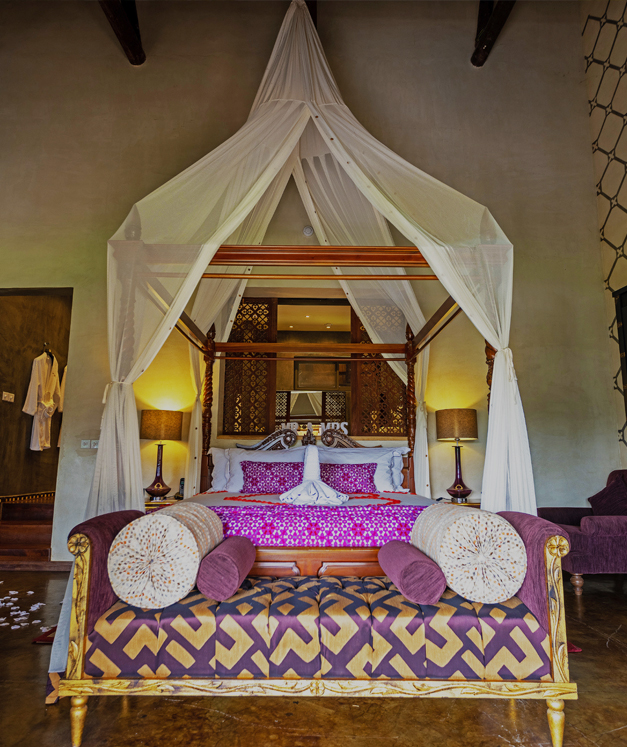 View of the four poster bed in The Picathartes Presidential Suite at The Royal Senchi Hotel & Resort, Ghana