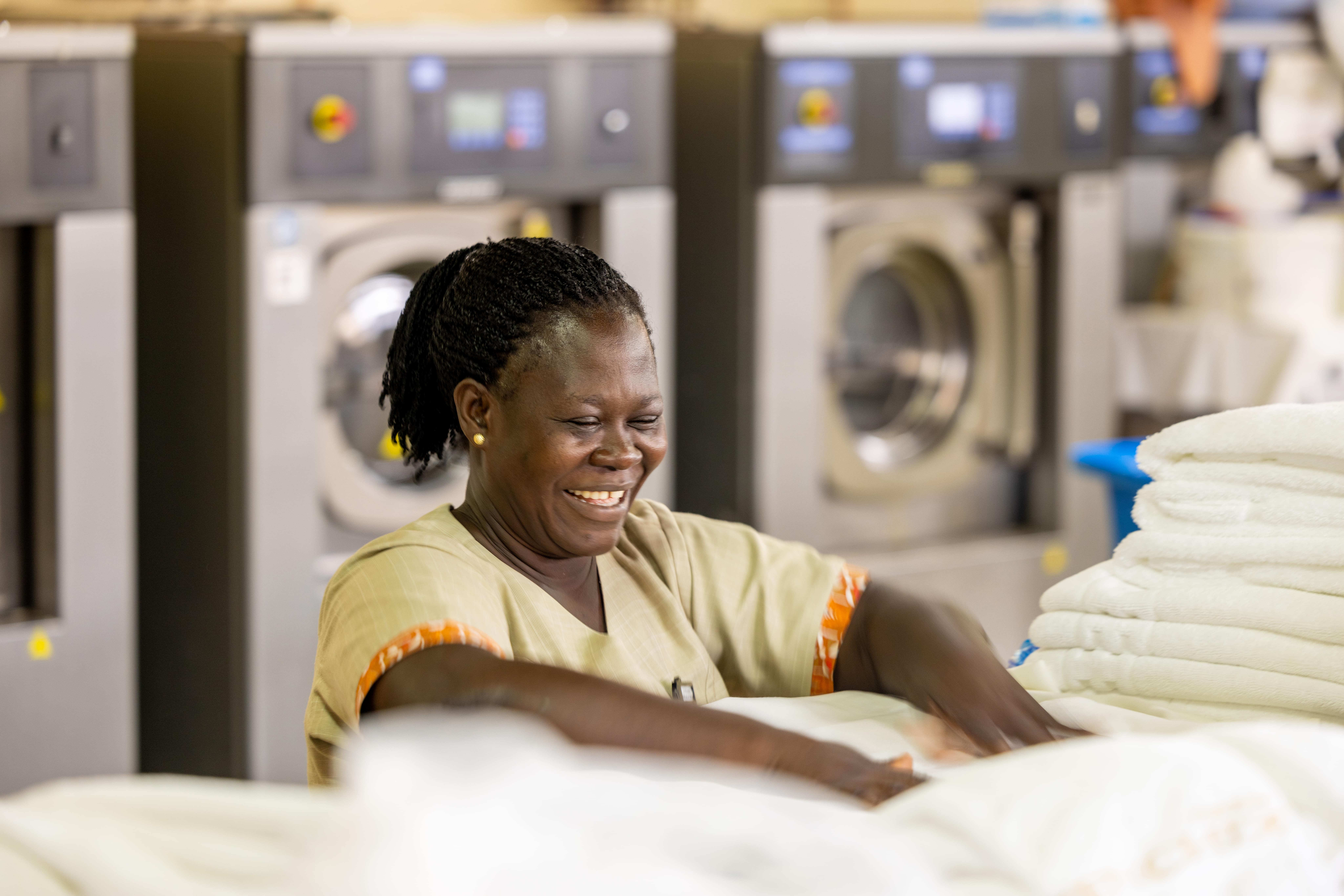 A beautiful staff member in our laundry room at The Royal Senchi Hotel & Resort in Ghana